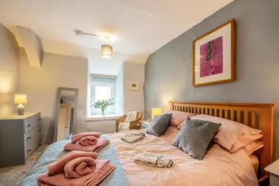 a bedroom with a bed with towels on it at 2 Bed in Trawsfynydd oc-t34148 in Trawsfynydd