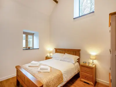 a bedroom with a bed with two towels on it at The Aran - Uk51067 in Frongoch