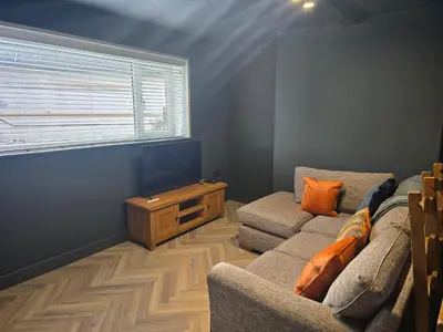 a living room with a couch and a window at The Resting Place in Aberystwyth