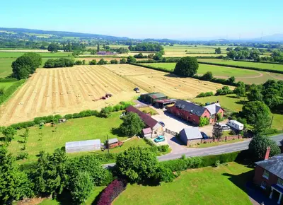 an aerial view of a farm with a field at Orchard Farm in Ludlow
