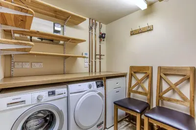 a laundry room with a washer and dryer at Orchard Farm in Ludlow