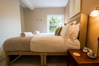 a bedroom with a bed with a window and a table at Fantastic 6-bedroom house close to Shrewsbury town - Pass the Keys in Shrewsbury
