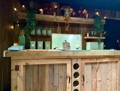 a wooden counter in a room with vases on it at Nesta's Nook in Llandovery