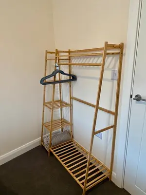 a ladder leaning against a wall next to a room at Unique Vicarage Town Cottage in Leominster
