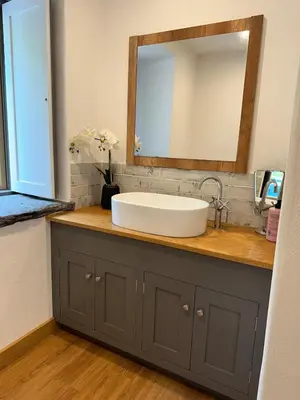 a bathroom counter with a sink and a mirror at Y Sgubor Bryn Banon in Bala