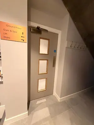 a hallway with a door with a sign on it at 3 Bed Spacious Luxury Duplex - Shrewsbury Town Centre in Shrewsbury