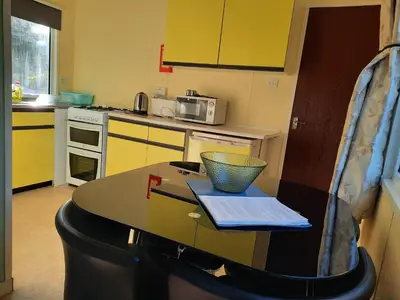 a kitchen with a table with a bowl on it at Cerdyn Villa in Llanwrtyd Wells