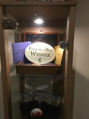 a box with a sign that says four in a bed winner at Bryn Derwen in Rhayader