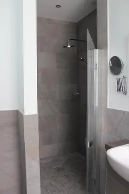 a bathroom with a shower and a sink at The Tilman in Barmouth