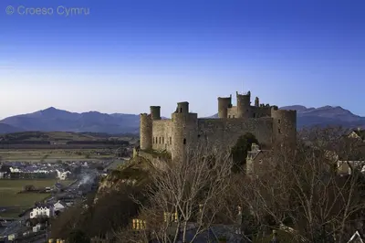 a castle sitting on top of a hill at Beudy Taicroesion in Barmouth