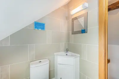 a bathroom with a toilet and a sink at 2 Bed in Bala oc-82768 in Llandderfel