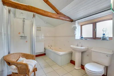 a bathroom with a sink toilet and a bath tub at 2 Bed in Aberdyfi oc-78258 in Pennal