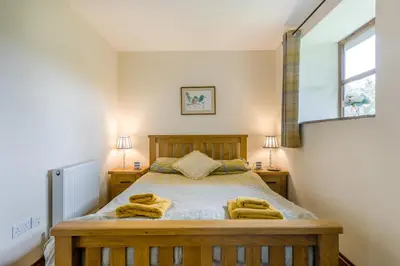 a bedroom with a bed with towels on it at 2 Bed in Builth Wells oc-39471 in Builth Wells