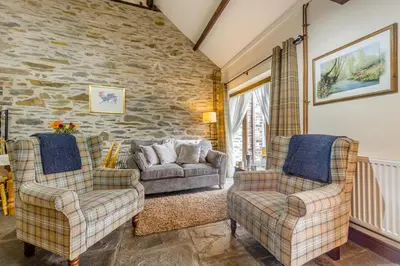 a living room with two chairs and a couch at 2 Bed in Builth Wells oc-39471 in Builth Wells