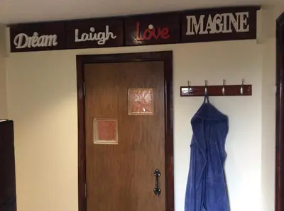 a sign above a door that says dream laugh love measure at Ty Mawr at Bethania B&B Rooms and Crumble Cottage in Llanon