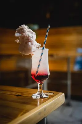 a drink sitting on a wooden table with a drink at The Albert Hotel in Shrewsbury