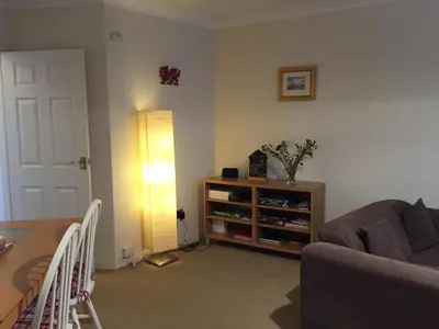 a living room with a couch and a table at No 6 Boleyn House in Brecon