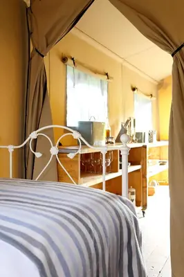 a bedroom with a bed in a tent at Drovers Rest Farm Stay in Hay-on-Wye