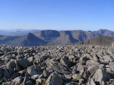 a large pile of rocks on top of a mountain at Taldraeth - Old Vicarage Guest House in Penrhyndeudreath