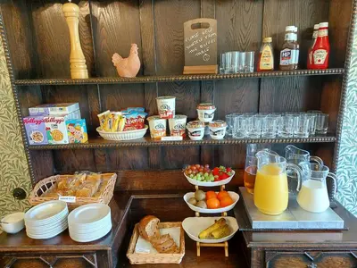 a shelf with a bunch of food and drinks at Bron-Y-Graig in Corwen