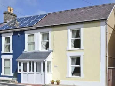 a house with solar panels on the roof at Montrose in New Quay