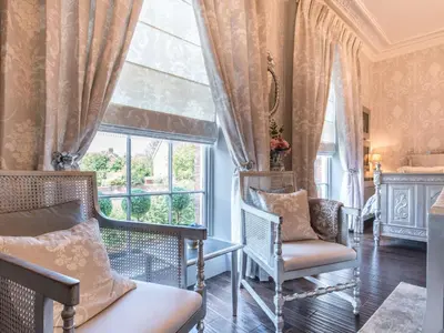a living room with chairs and a window at Beautifully decorated, elegant apartment near town - Pass the Keys in Shrewsbury