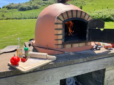 a pizza oven sitting on top of a table at The Pod & Cwtch luxury accommodation in Aberaeron