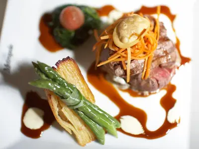 a plate of food with a sandwich and vegetables at Metropole Hotel and Spa in Llandrindod Wells