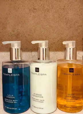 three bottles of soap sitting next to each other at The Falcondale Country House Hotel in Lampeter