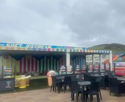 a restaurant with tables and chairs in front of it at Sea retreat caravans in Aberystwyth