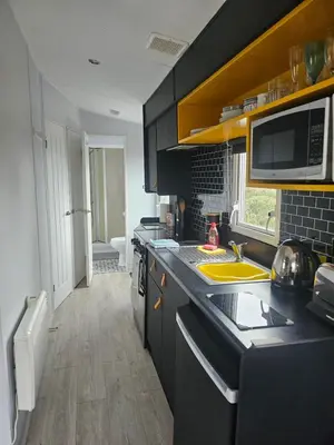 a kitchen with a sink and a counter top at Ruth's Rest Country Retreat with private Hot Tub & Views of Open Countryside in Shrewsbury