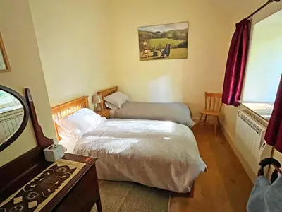 a hotel room with two beds and a stove at Drovers Retreat in Llandrindod Wells