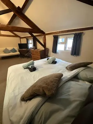a bedroom with a large white bed in a room at 36 Heritage House in Kington