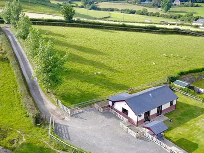 an aerial view of a barn in a field at River Cottage in Llangunllo