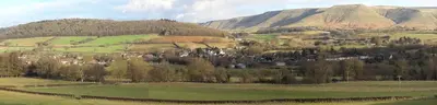 a town on a hill with a mountain in the background at Carinya in Talgarth