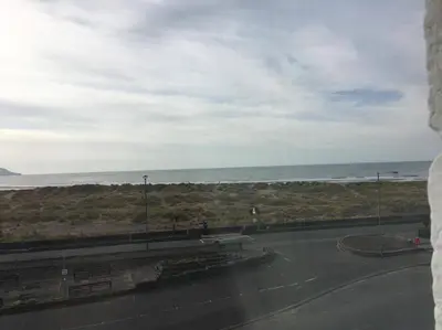 a view of the ocean from a building at Bluebells guest house in Barmouth