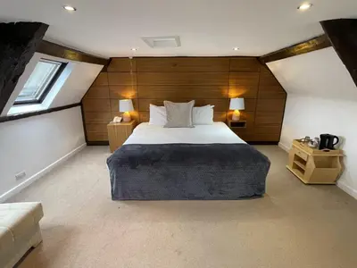 a bedroom with a large bed in a room at The Castle Hotel in Llandovery