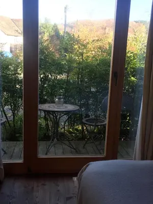 a room with a window with a table outside at Pandy B&B in Dorstone
