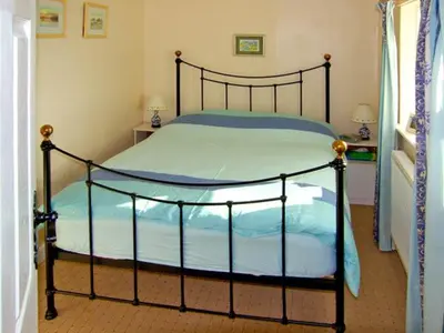 a bedroom with a large bed in a room at Trem y Mor in Harlech