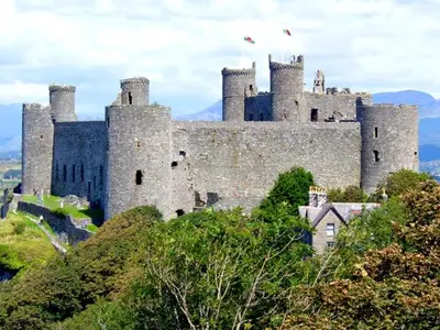 a castle sitting on top of a hill at Trem y Mor in Harlech