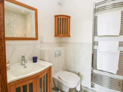 a bathroom with a toilet and a sink at Old Coach House in Shrawardine