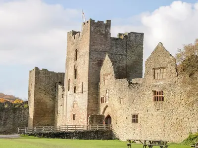a castle with a bench in front of it at Stargazer's Loft in Clifford