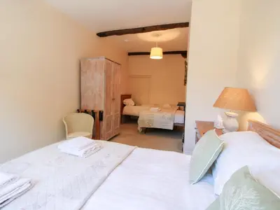 a bedroom with a bed and a room with a bedroomicterictericterictericter at The Maltster's House in Ludlow