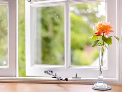 a vase with a flower on a window sill at The Cider Mill in Kings Pyon