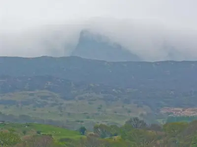 a view of a valley with a mountain in the background at Llechwedd in Dolgellau