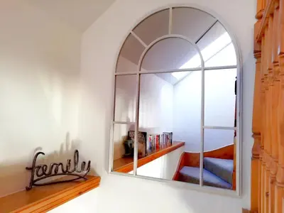 a large mirror on a wall in a room at Tangaer Cottage in Cellan