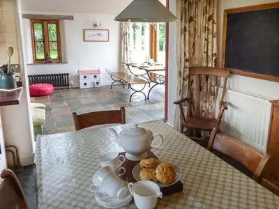 a table with a plate of food on top of it at Gatehouse in Painscastle