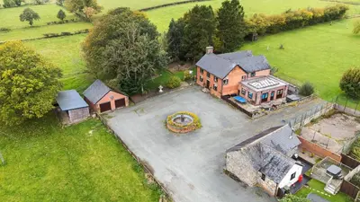 an aerial view of a large house with a yard at Bwthyn Ty Newydd in Pont Dolanog