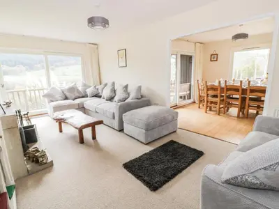 a living room with a couch and a table at Middle Hivron in Bleddfa