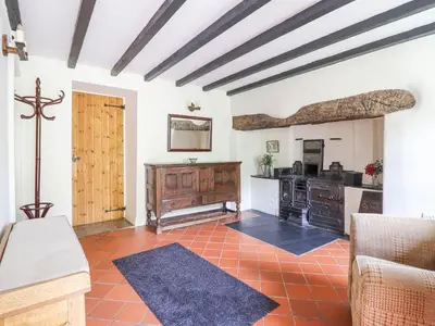 a living room with a couch and a table at Bodywen in Llangynog